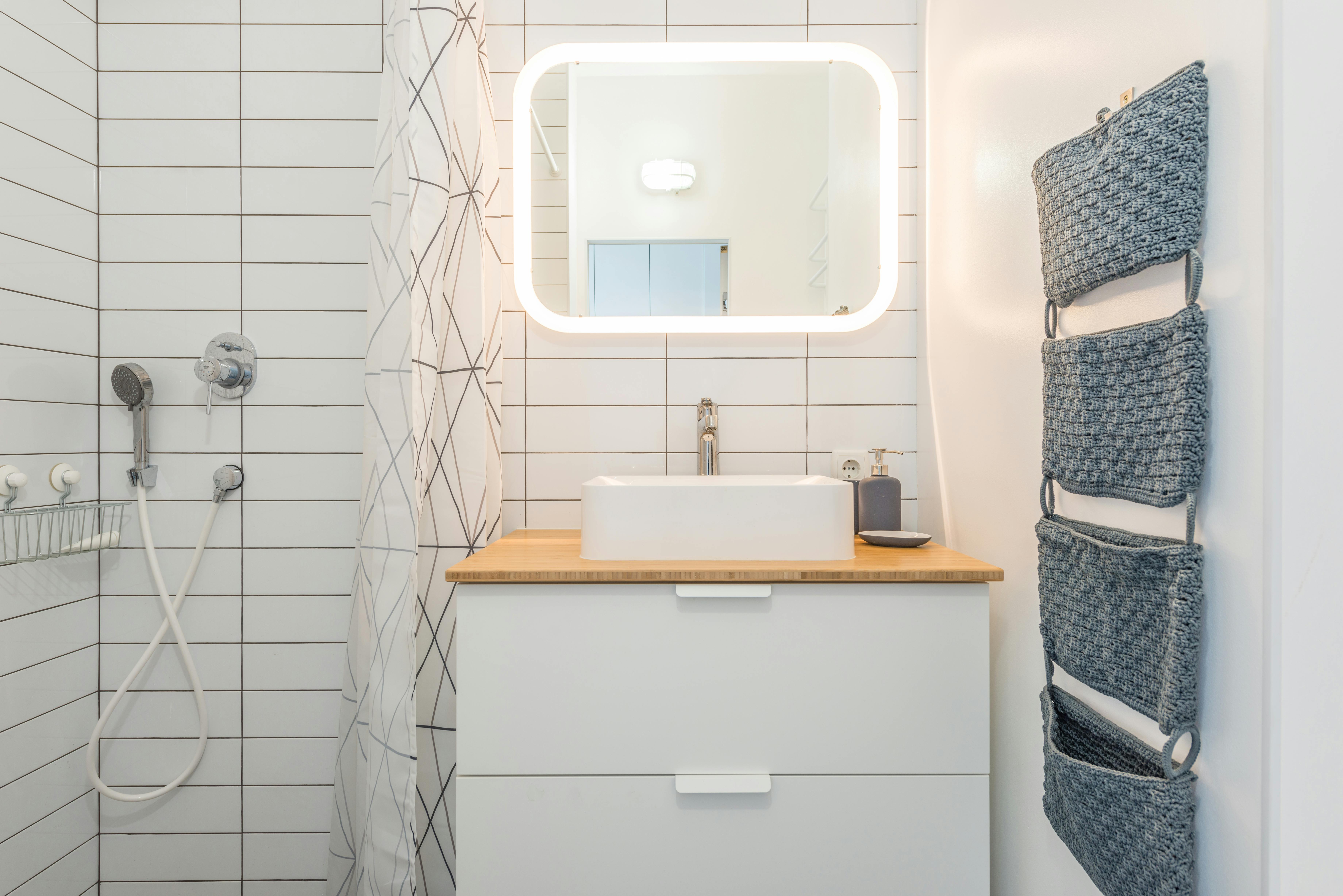 Bathroom cabinet with labeled bins and containers